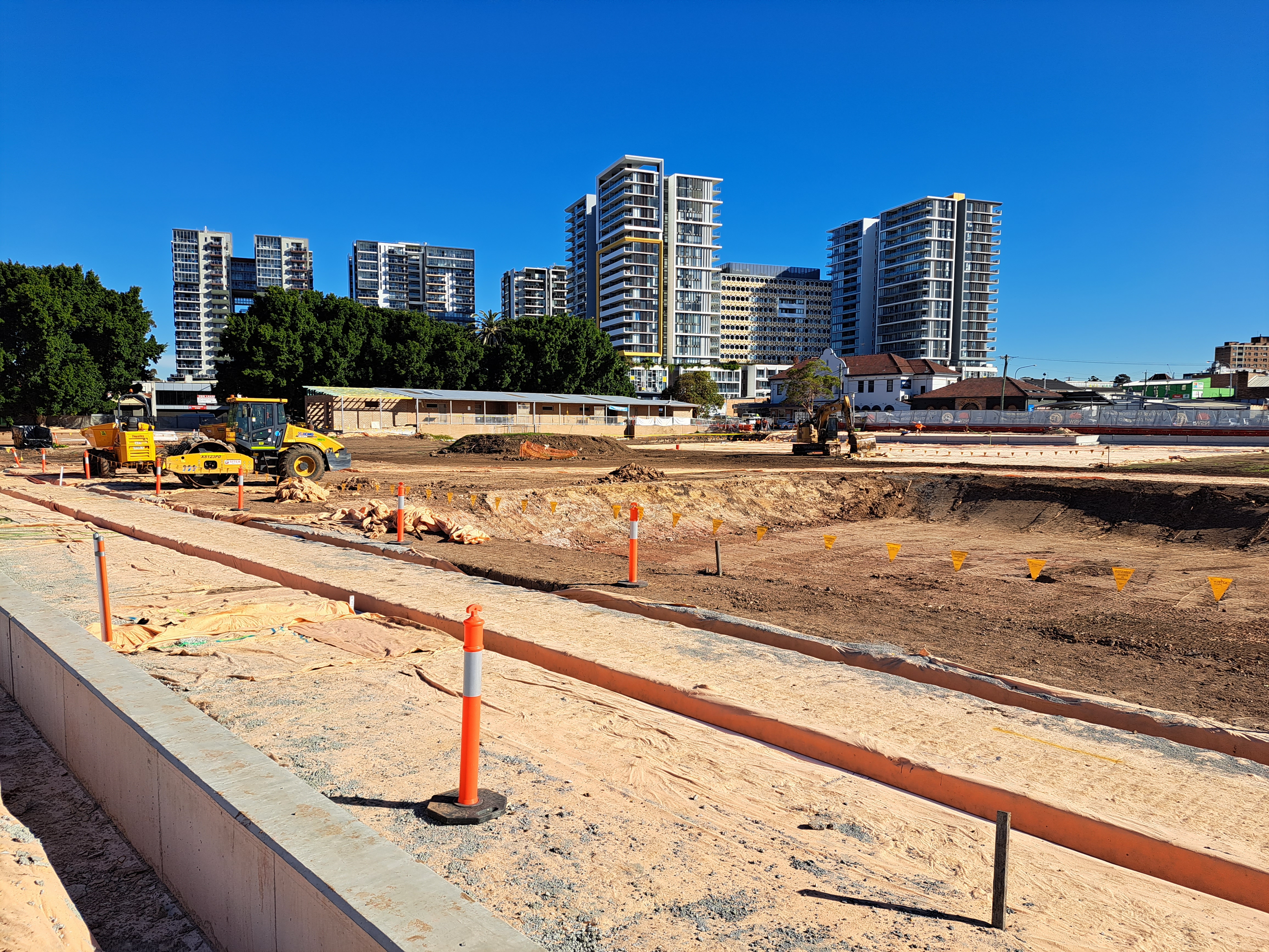 Image of site under construction looking towards apartments in Granville